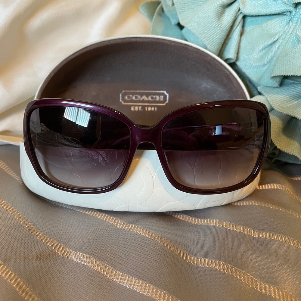 Purple Coach sunglasses with white case
